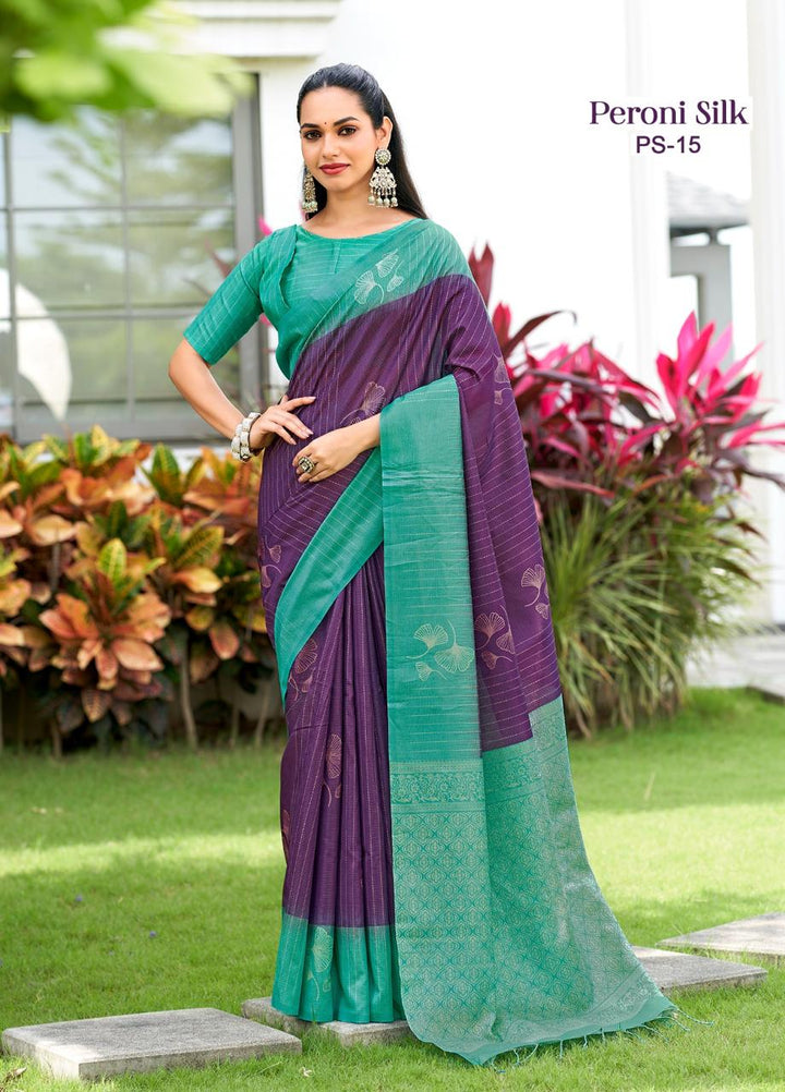 Woman wearing a purple and green saree with Peroni Silk branding in an outdoor setting.