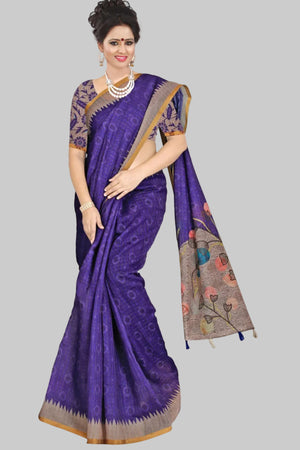 Woman wearing a purple saree with a plant in the background, featuring the brand 'Pannalakshmi'.